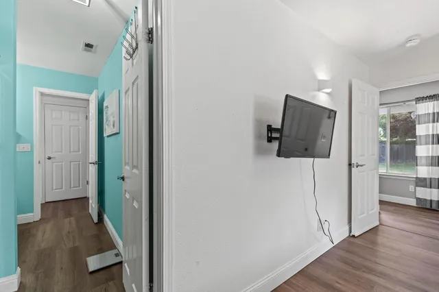 a bathroom with a toilet a sink and a mirror