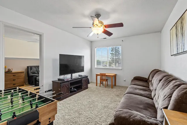 a bedroom with furniture and a window