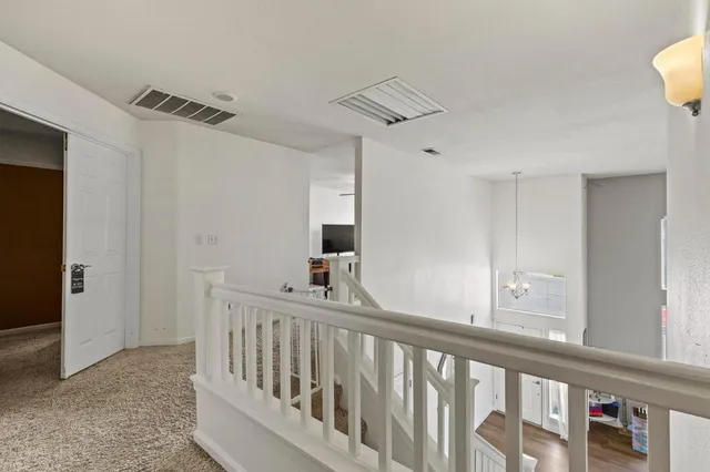 a bedroom with a bed dresser and a window