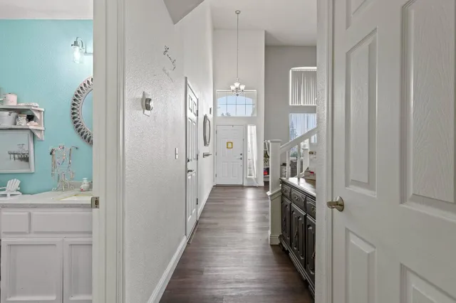 a view of a house with a swimming pool and a yard