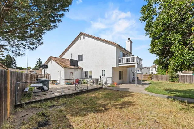 a view of a small house in the back yard