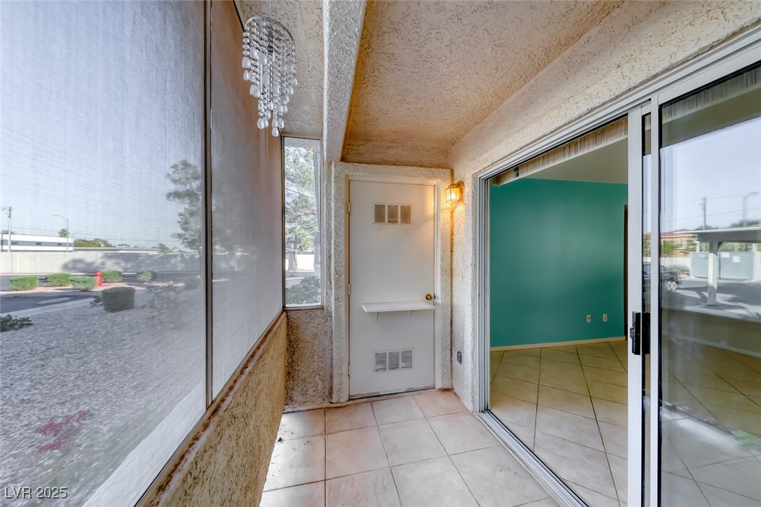 3425 East Russell Road, Unit 147 Las Vegas, NV 89120 - Photo 27 of 33 Patio is enclosed w/ solar shades - Storage cabinet for all your utility needs