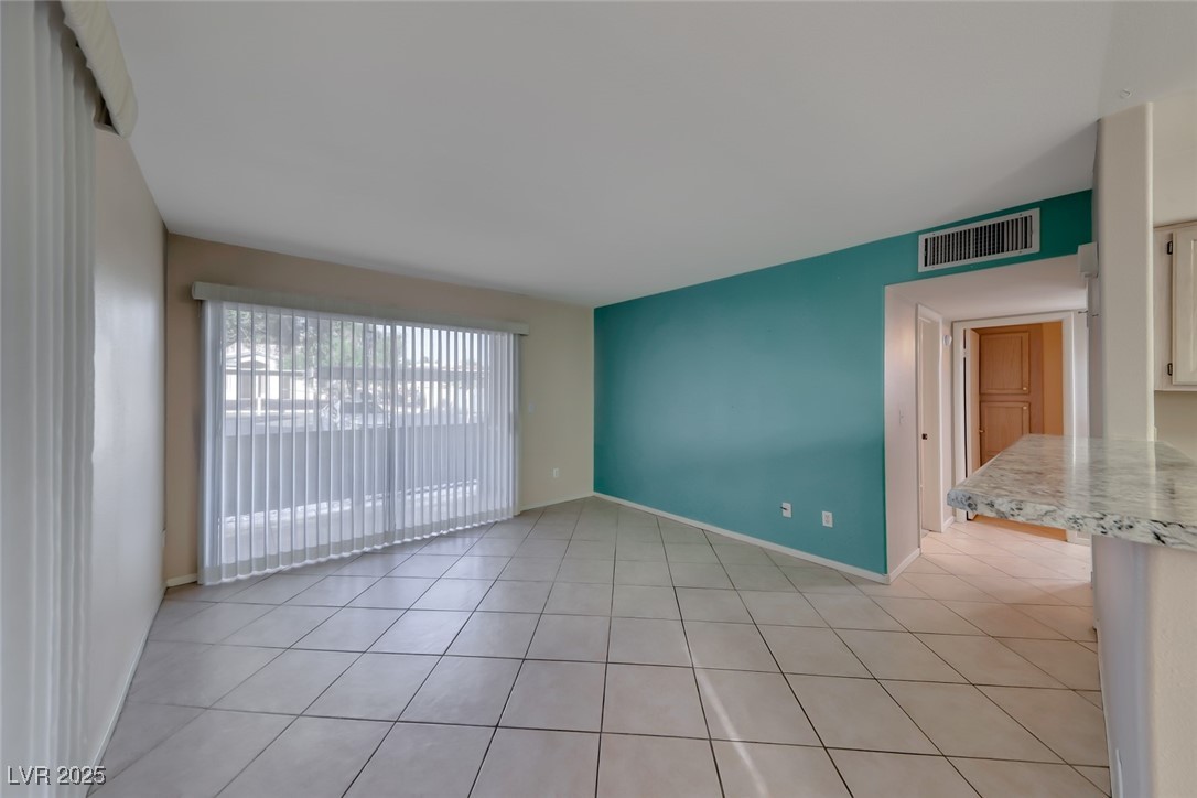 3425 East Russell Road, Unit 147 Las Vegas, NV 89120 - Photo 6 of 33 Slider to enclosed patio, breakfast bar at kitchen