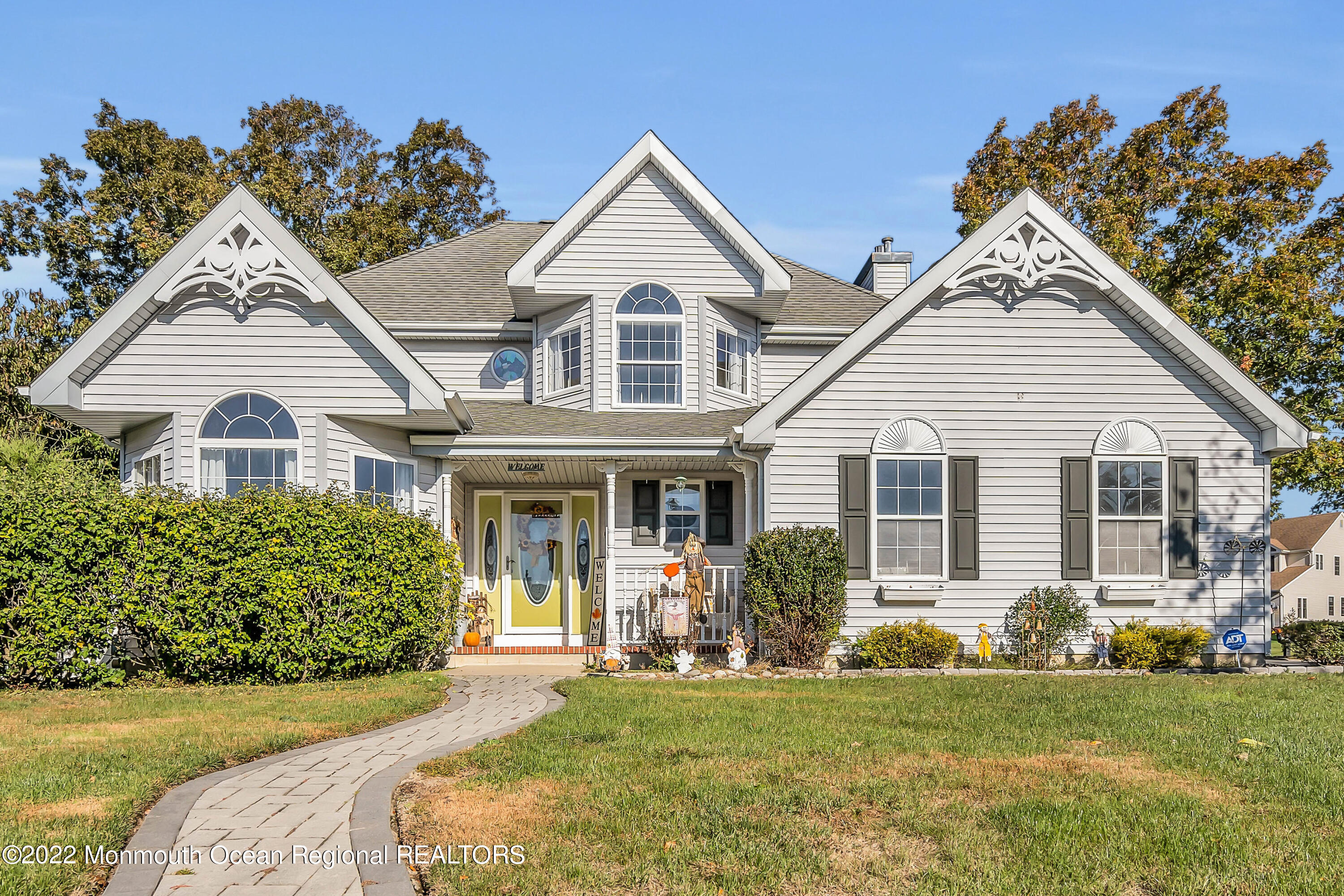 124 Compass Road Manahawkin, NJ 08050 - Photo 1 of 36 a view of a yard in front of house