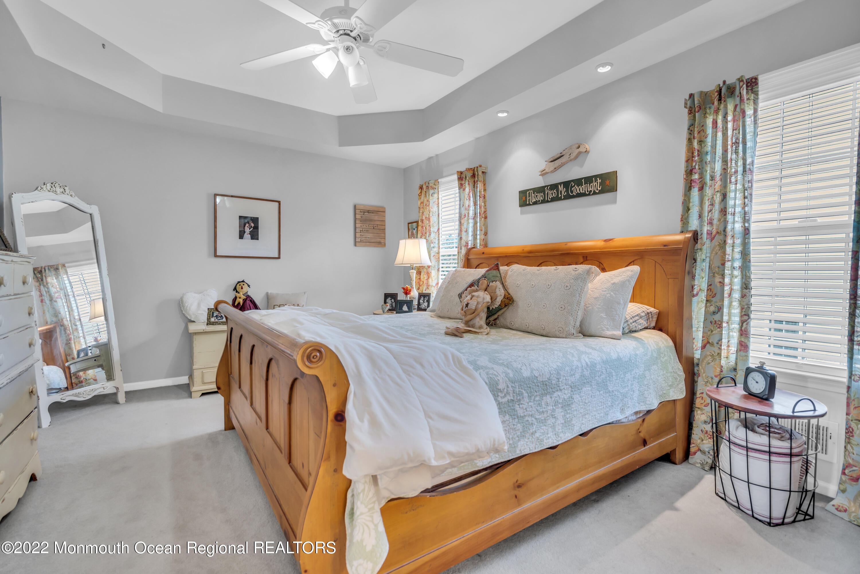124 Compass Road Manahawkin, NJ 08050 - Photo 20 of 36 a spacious bedroom with a bed and a chandelier