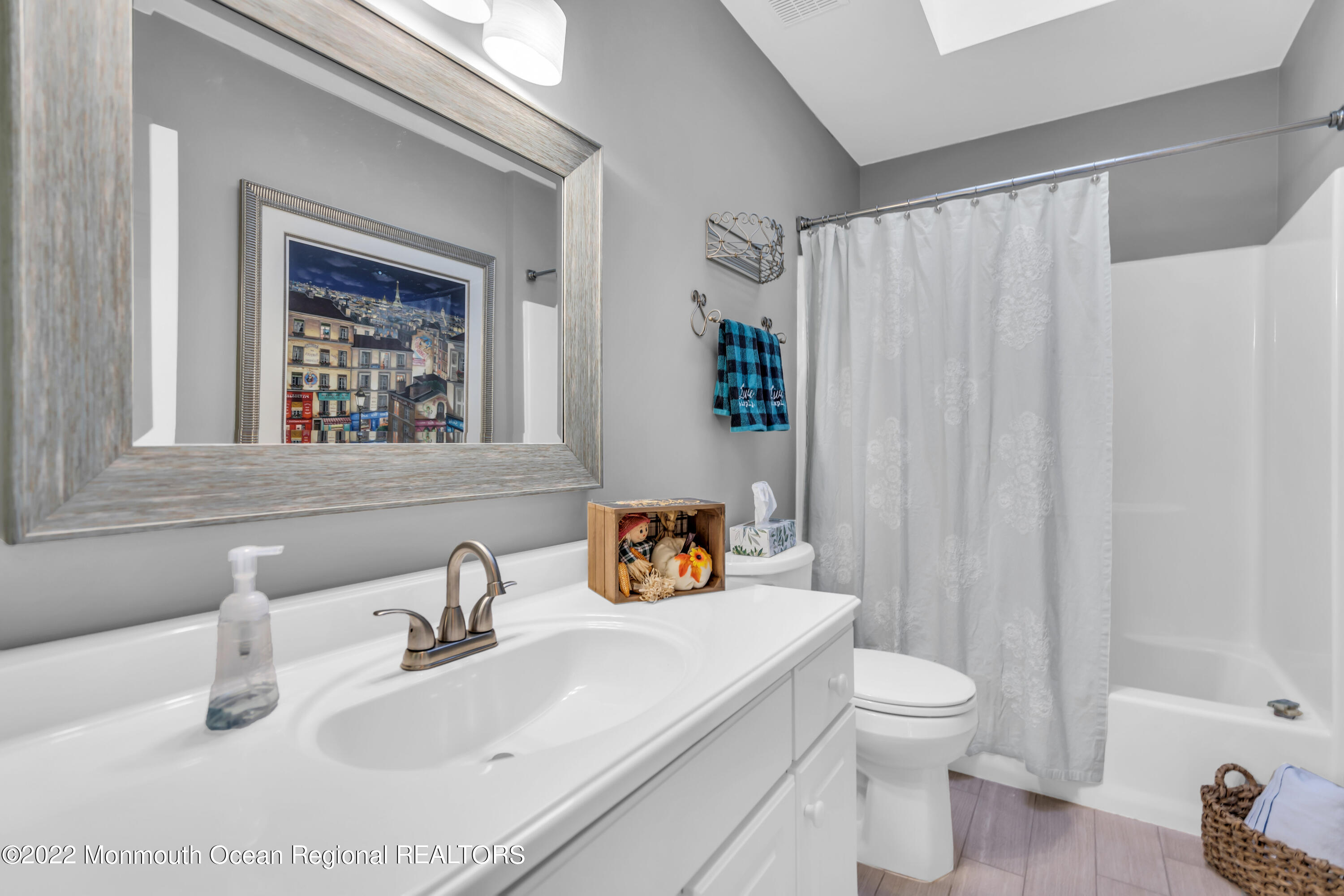 124 Compass Road Manahawkin, NJ 08050 - Photo 25 of 36 a bathroom with a sink toilet and shower