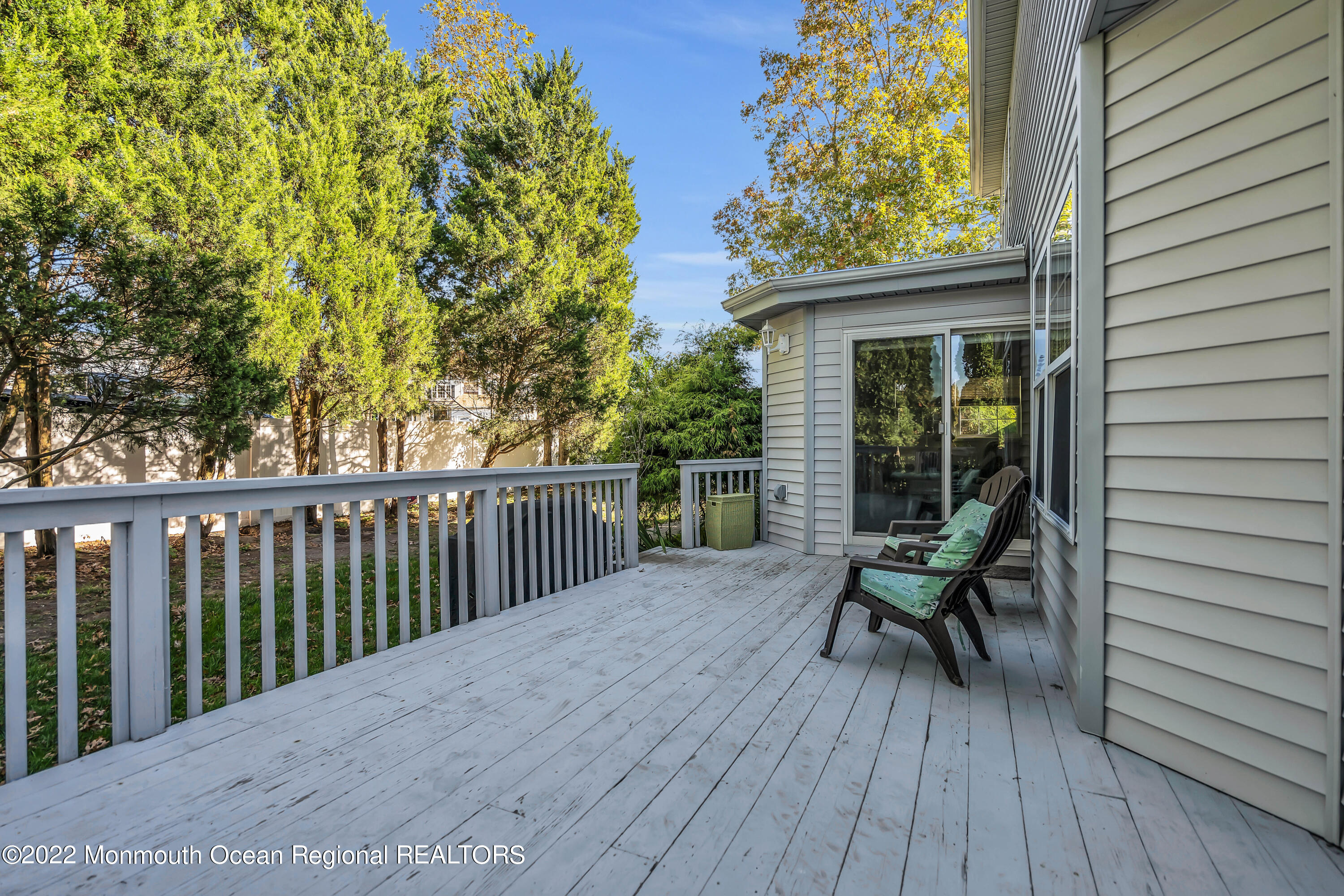 124 Compass Road Manahawkin, NJ 08050 - Photo 34 of 36 a view of backyard with a deck and wooden floor