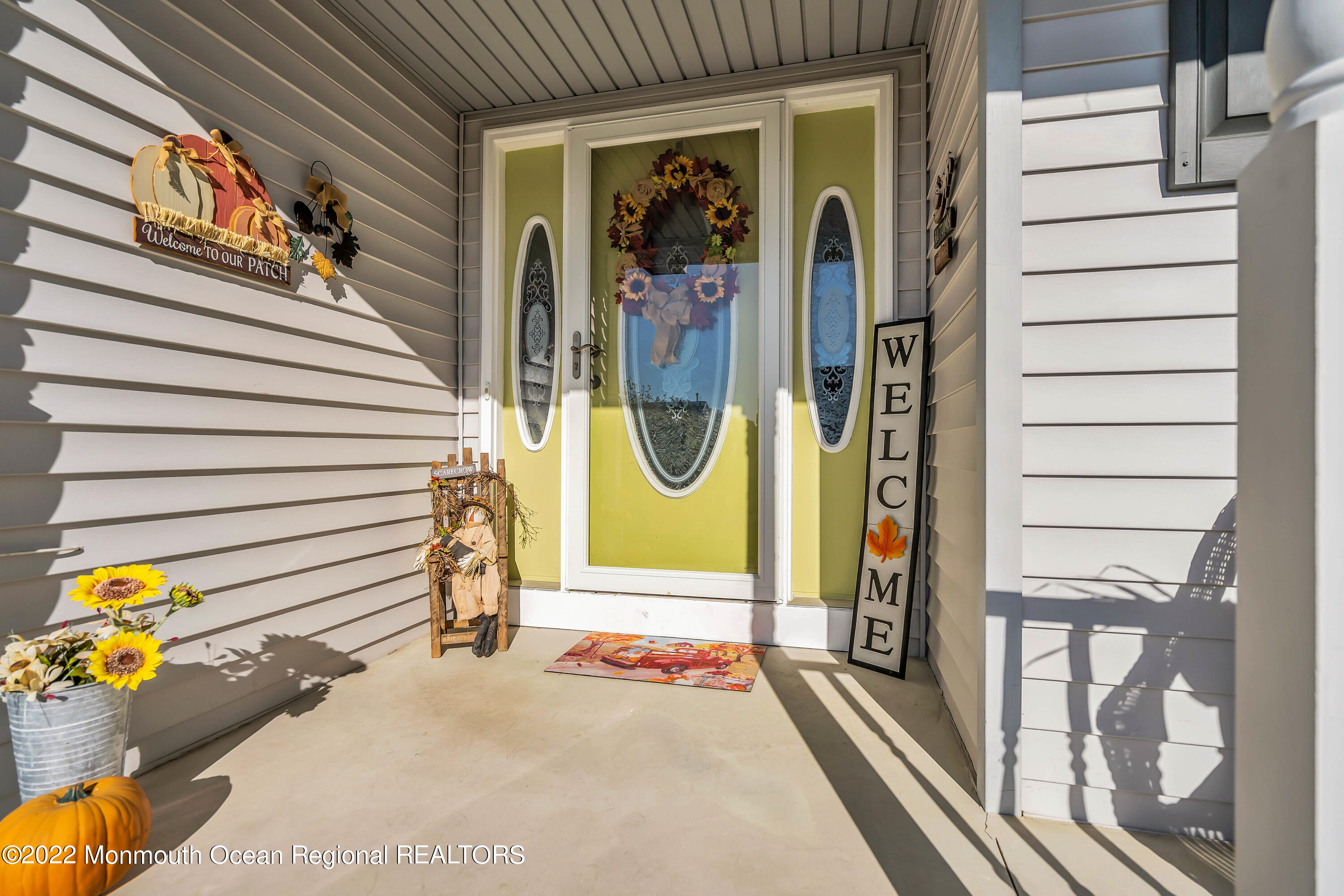 124 Compass Road Manahawkin, NJ 08050 - Photo 5 of 36 a view of a door of the house with outdoor seating