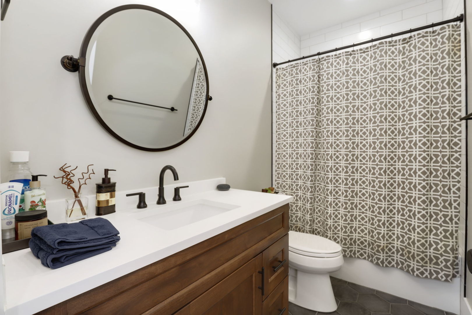 3048 West Lyndale Street, Unit 2 Chicago, IL 60647 - Photo 21 of 40 a bathroom with a sink a toilet and a mirror
