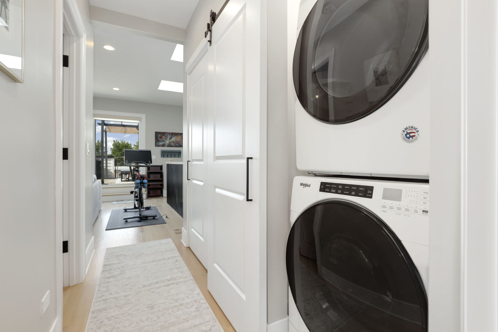 3048 West Lyndale Street, Unit 2 Chicago, IL 60647 - Photo 25 of 40 a view of a hallway with washer and dryer