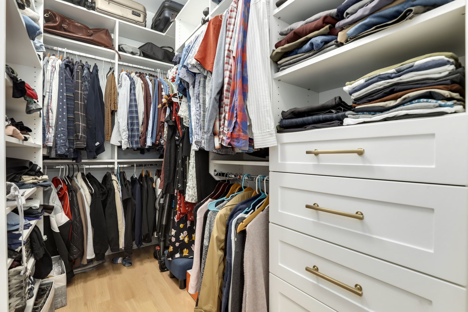 3048 West Lyndale Street, Unit 2 Chicago, IL 60647 - Photo 26 of 40 a view of walk in closet with clothes and shoes