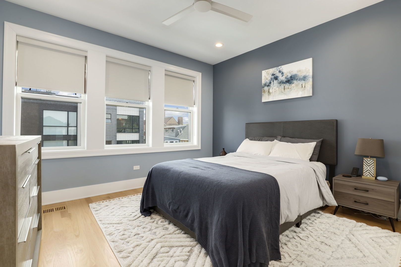 3048 West Lyndale Street, Unit 2 Chicago, IL 60647 - Photo 29 of 40 a bedroom with a large bed and a window