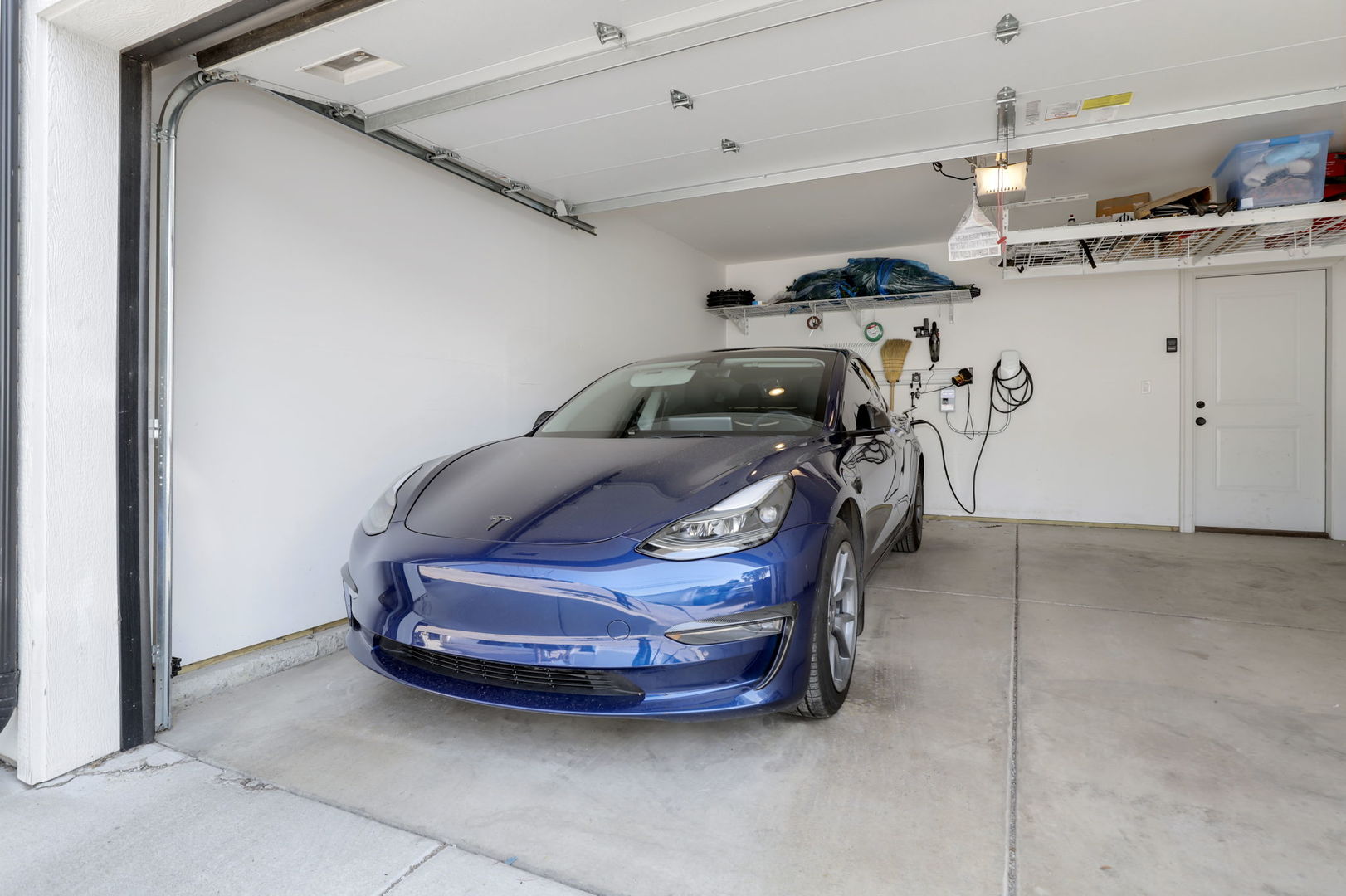 3048 West Lyndale Street, Unit 2 Chicago, IL 60647 - Photo 32 of 40 a car parked in a garage