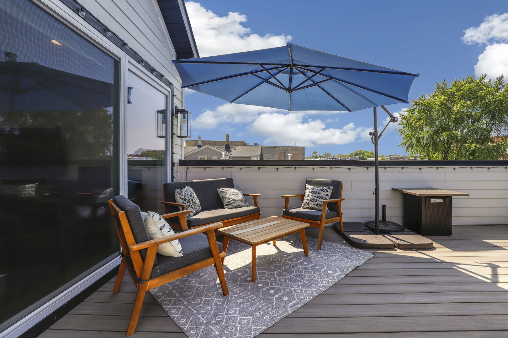 3048 West Lyndale Street, Unit 2 Chicago, IL 60647 - Photo 34 of 40 an outdoor sitting area with furniture and umbrella