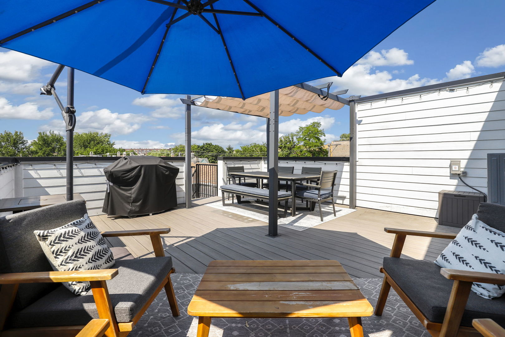 3048 West Lyndale Street, Unit 2 Chicago, IL 60647 - Photo 36 of 40 a view of a patio with a table chairs and a umbrella