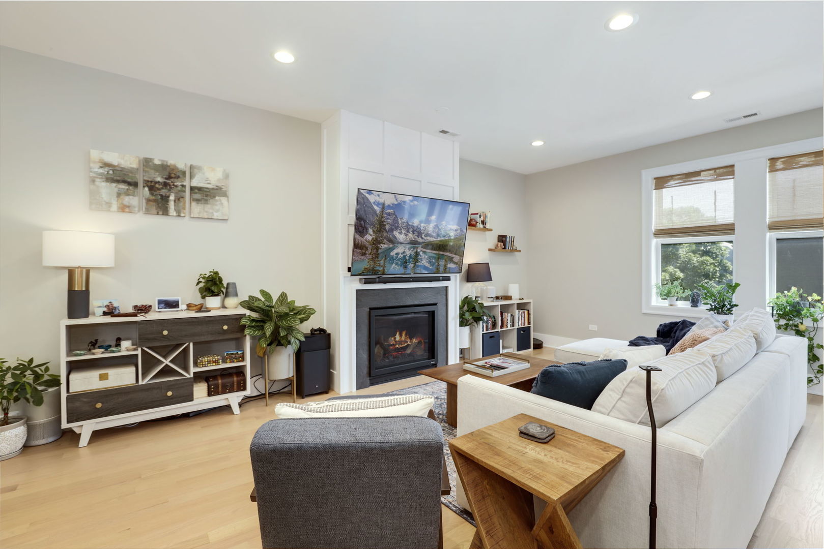 3048 West Lyndale Street, Unit 2 Chicago, IL 60647 - Photo 8 of 40 a living room with furniture and a fireplace