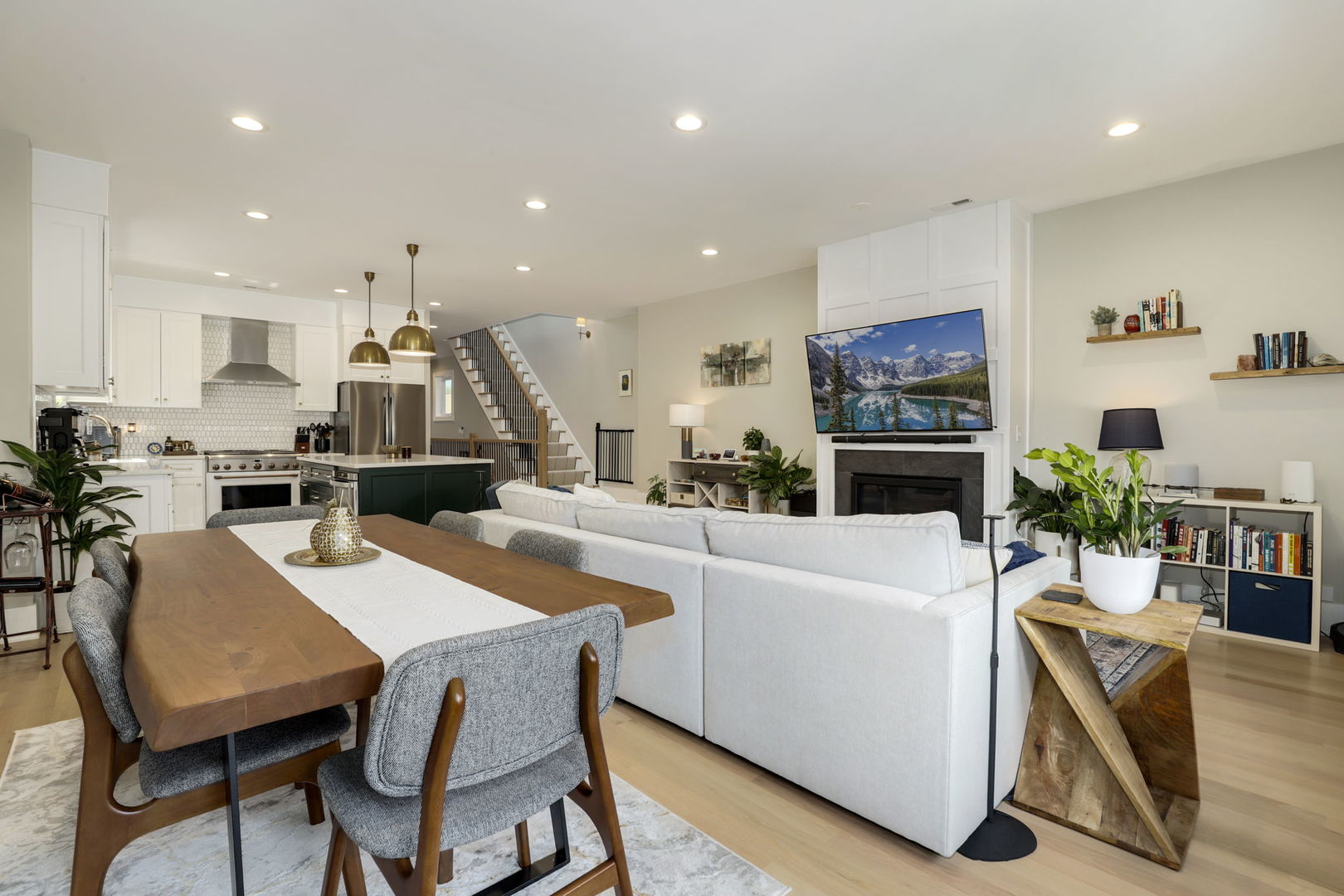 3048 West Lyndale Street, Unit 2 Chicago, IL 60647 - Photo 10 of 40 a living room with stainless steel appliances furniture a dining table and a kitchen view