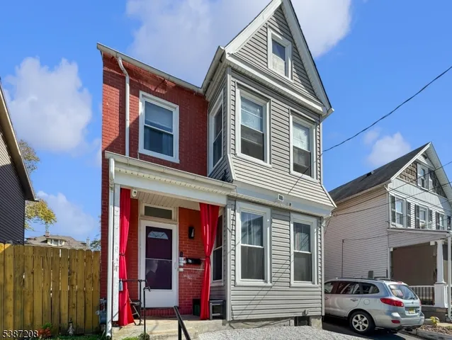 a front view of a house with parking