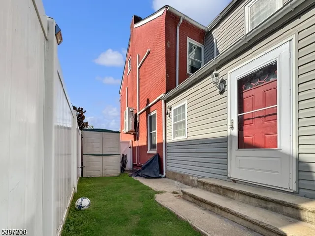 a view of a back yard of the house