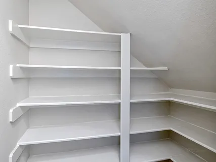 a view of an empty walk in closet