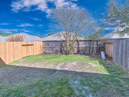 a view of a backyard with a small cabin