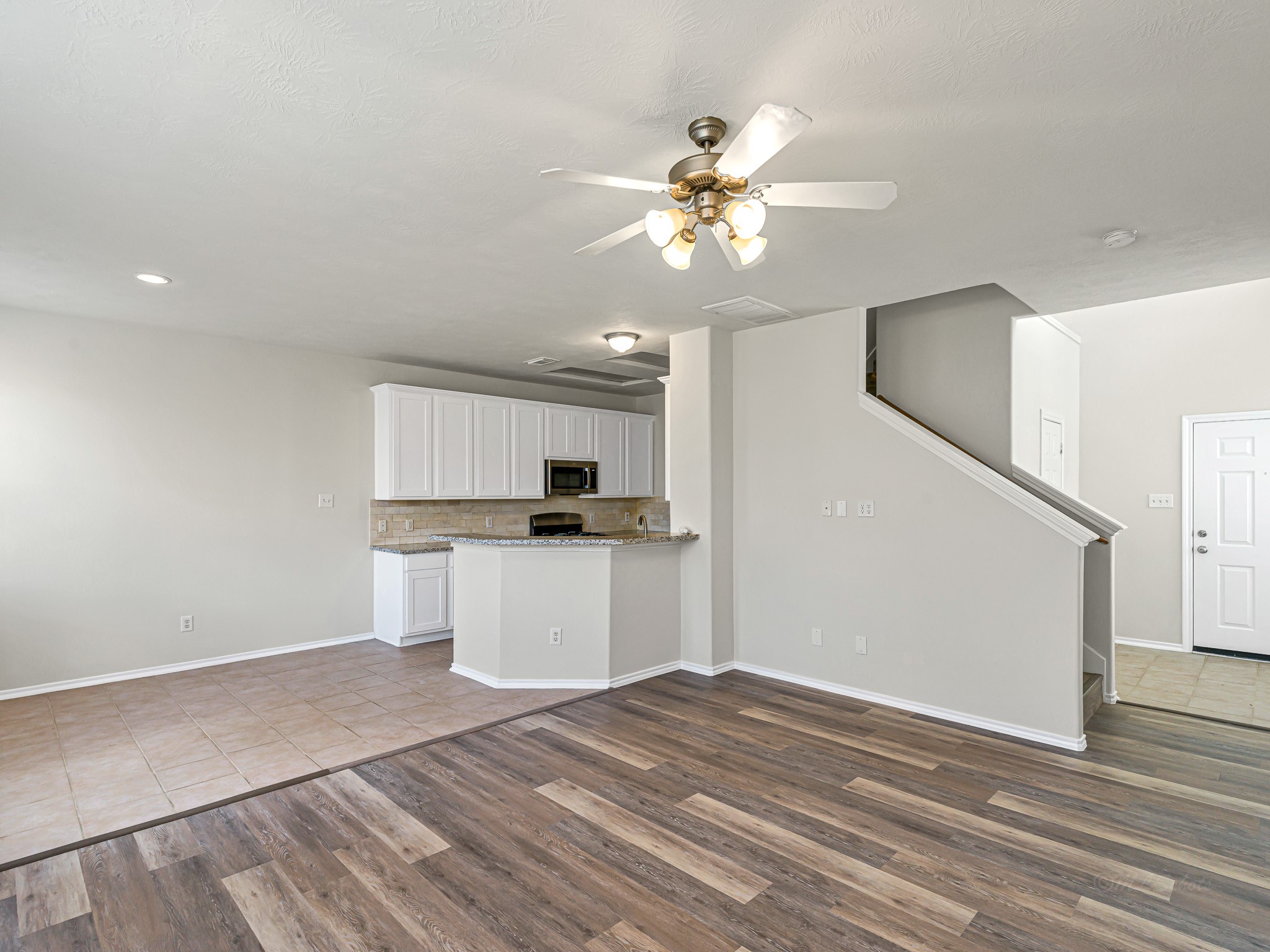 5631 Stonecloud Lane Katy, TX 77494 - Photo 8 of 31 a kitchen with kitchen island stainless steel appliances a sink and cabinets