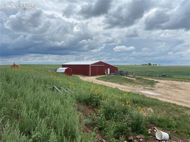 8085 Boone Road Yoder, CO 80864 - Photo 3 of 4 Huge Barn with Lean To and additional Storage Sheds