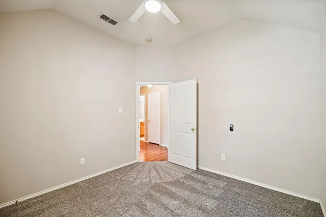 an empty room with an entryway door