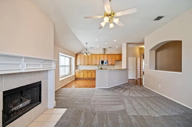a view of a kitchen with a sink and a refrigerator
