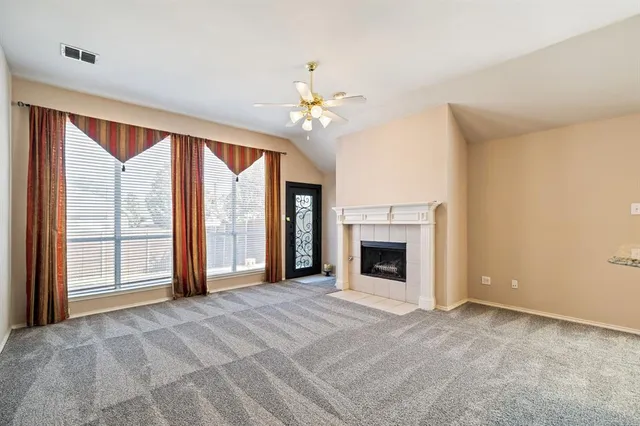 a kitchen with kitchen island granite countertop a stove and a sink