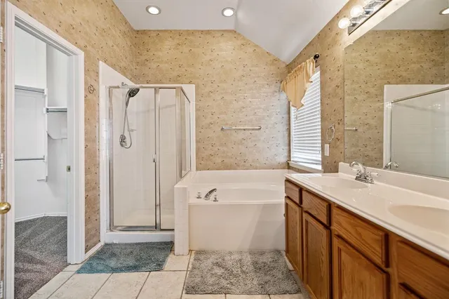 a bathroom with a sink a mirror and a bathtub