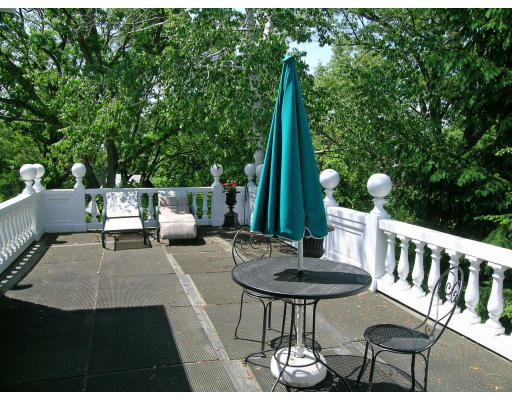 59 Wachusett Road Newton, MA 02467 - Photo 12 of 14 a view of balcony with a patio and a garden