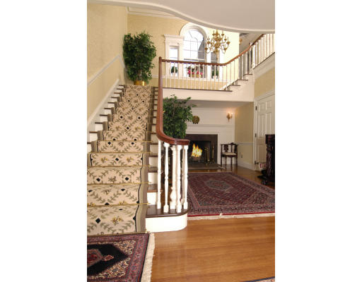 59 Wachusett Road Newton, MA 02467 - Photo 2 of 14 a view of a hallway with wooden floor and dining room