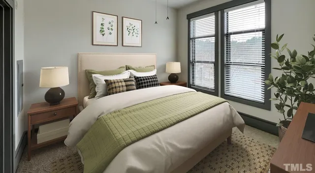 a living room with furniture and a view of kitchen