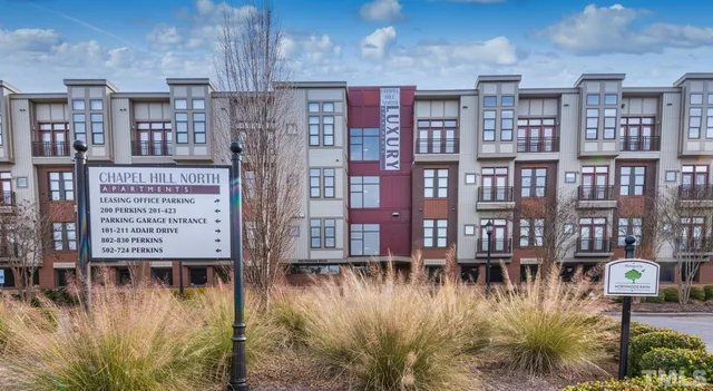 a view of swimming pool with outdoor seating and plants