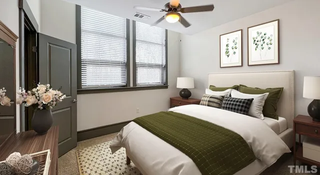 a bed room with a bed and a night stand