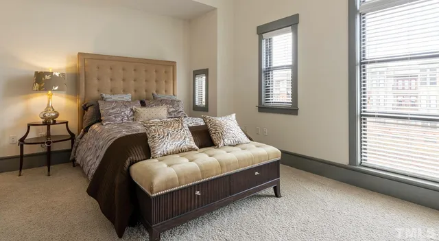 a kitchen with stainless steel appliances a refrigerator and wooden floor