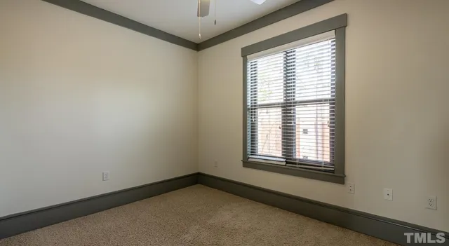 a kitchen with a refrigerator and a stove top oven