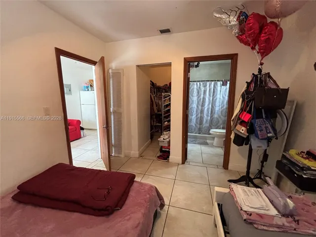 a living room with a couch and a closet