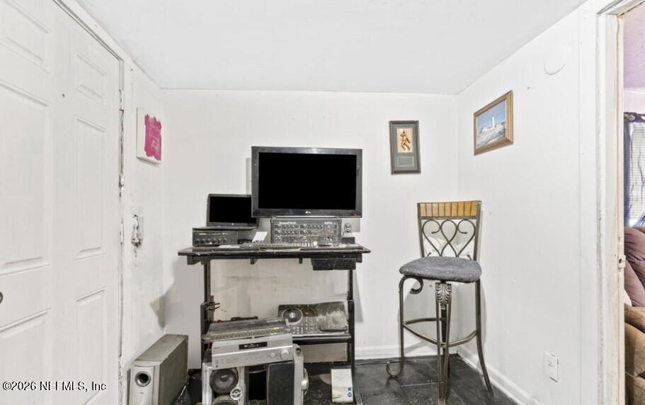 3131 Dignan Street Jacksonville, FL 32254 - Photo 11 of 16 a living room with furniture and a flat screen tv