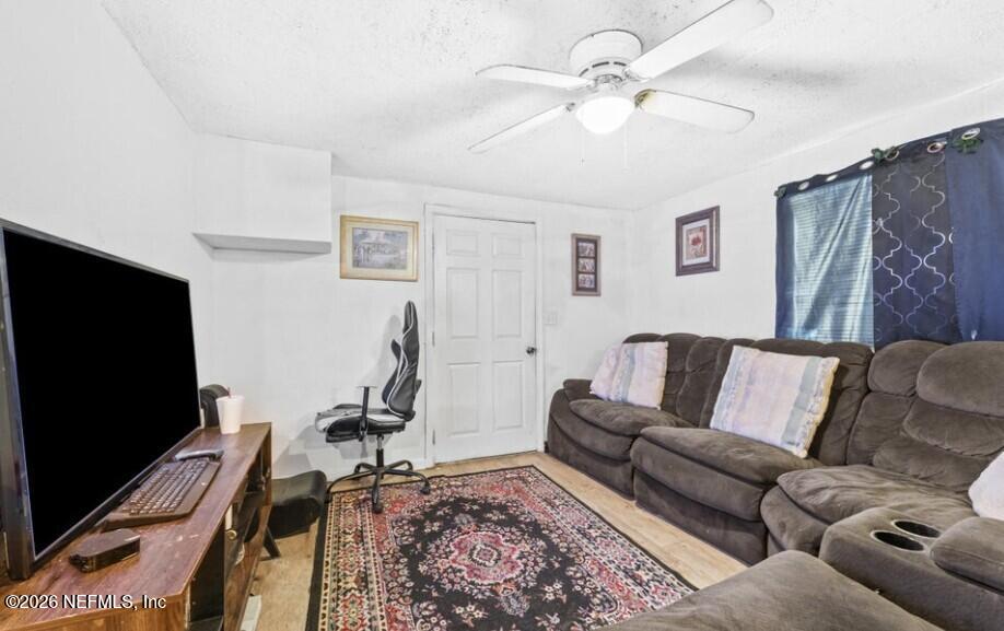 3131 Dignan Street Jacksonville, FL 32254 - Photo 5 of 16 a living room with furniture and a flat screen tv