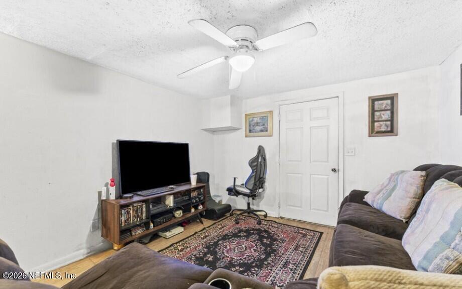 3131 Dignan Street Jacksonville, FL 32254 - Photo 6 of 16 a living room with furniture and a flat screen tv