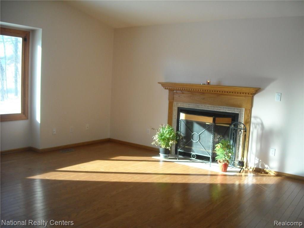 5024 Carroll Lk Road Commerce Township, MI 48382 - Photo 9 of 18 Great Room with Hardwood