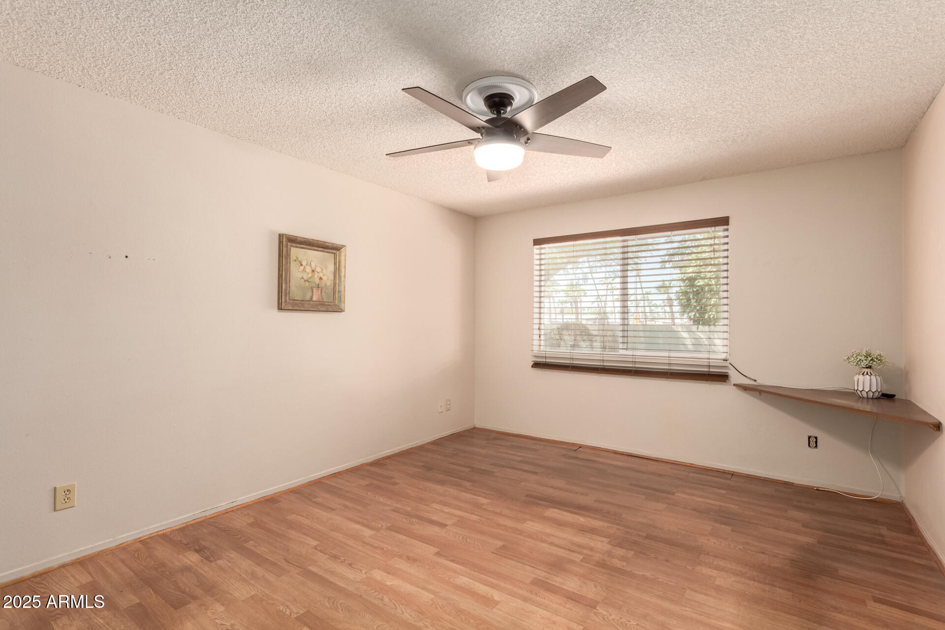 131 North Higley Road, Unit 1 Mesa, AZ 85205 - Photo 12 of 32 a view of an empty room with a window