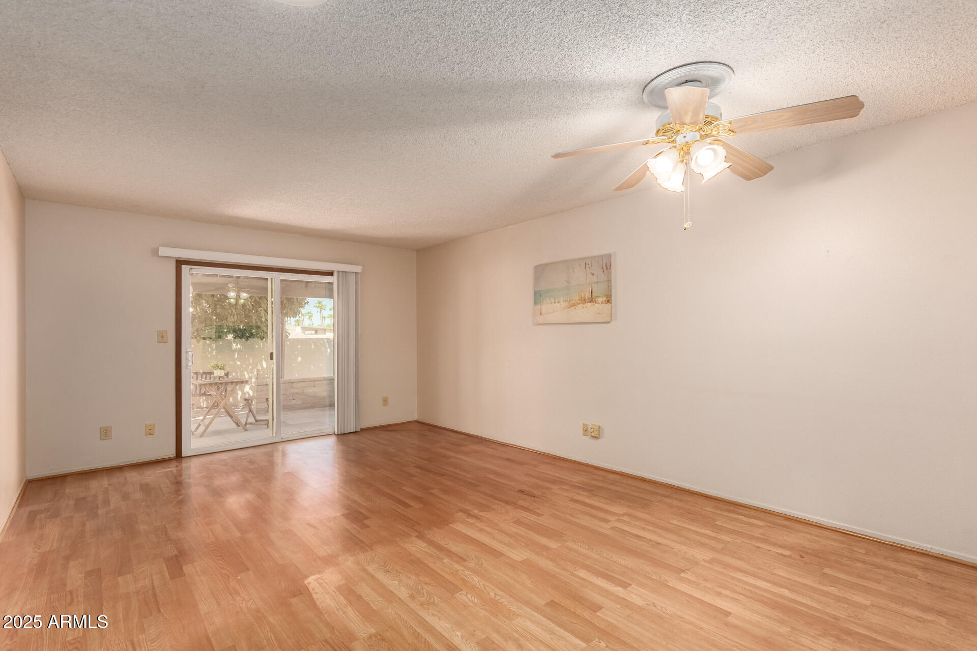 131 North Higley Road, Unit 1 Mesa, AZ 85205 - Photo 2 of 32 wooden floor in an empty room with a window