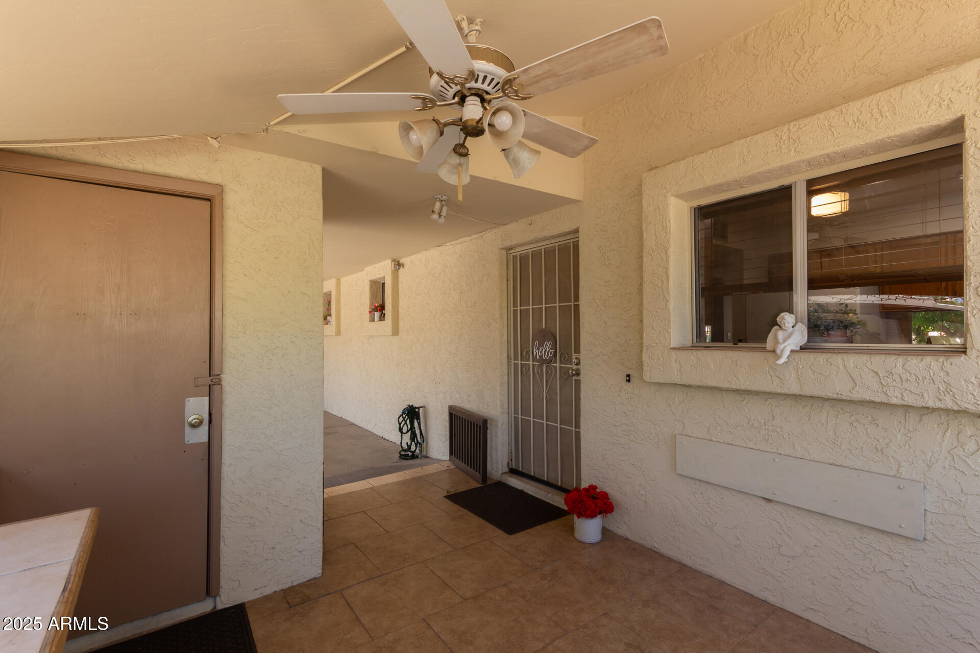 131 North Higley Road, Unit 1 Mesa, AZ 85205 - Photo 6 of 32 a view of livingroom with hardwood floor and a ceiling fan