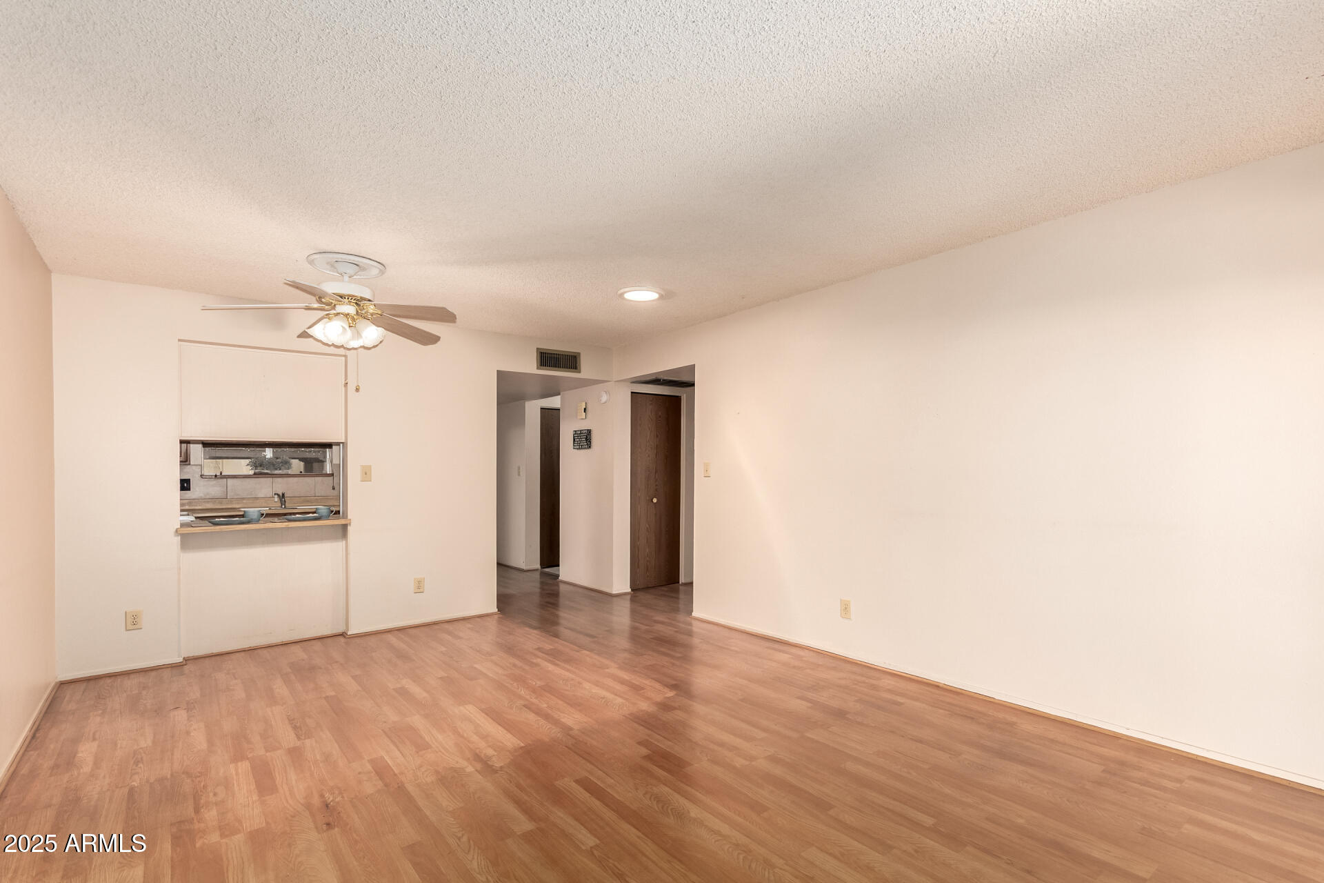 131 North Higley Road, Unit 1 Mesa, AZ 85205 - Photo 10 of 32 a view of a kitchen with a sink and a refrigerator