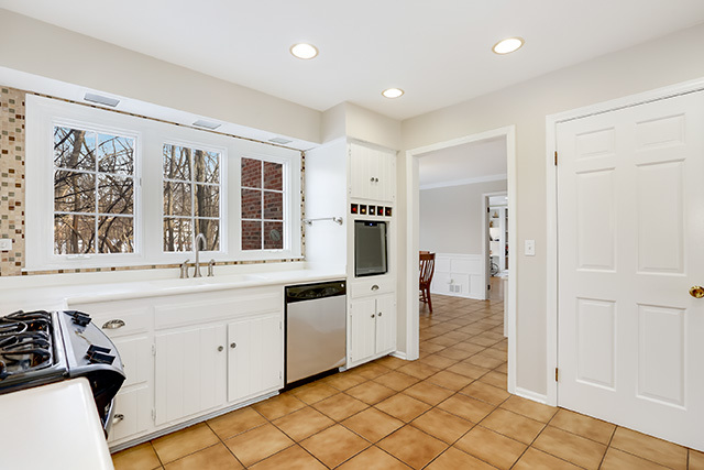 225 Ela Road Inverness, IL 60067 - Photo 14 of 49 a kitchen with stainless steel appliances granite countertop a refrigerator and a sink