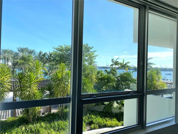 a view of a room with a large window