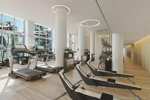 a room with lots of gym equipment